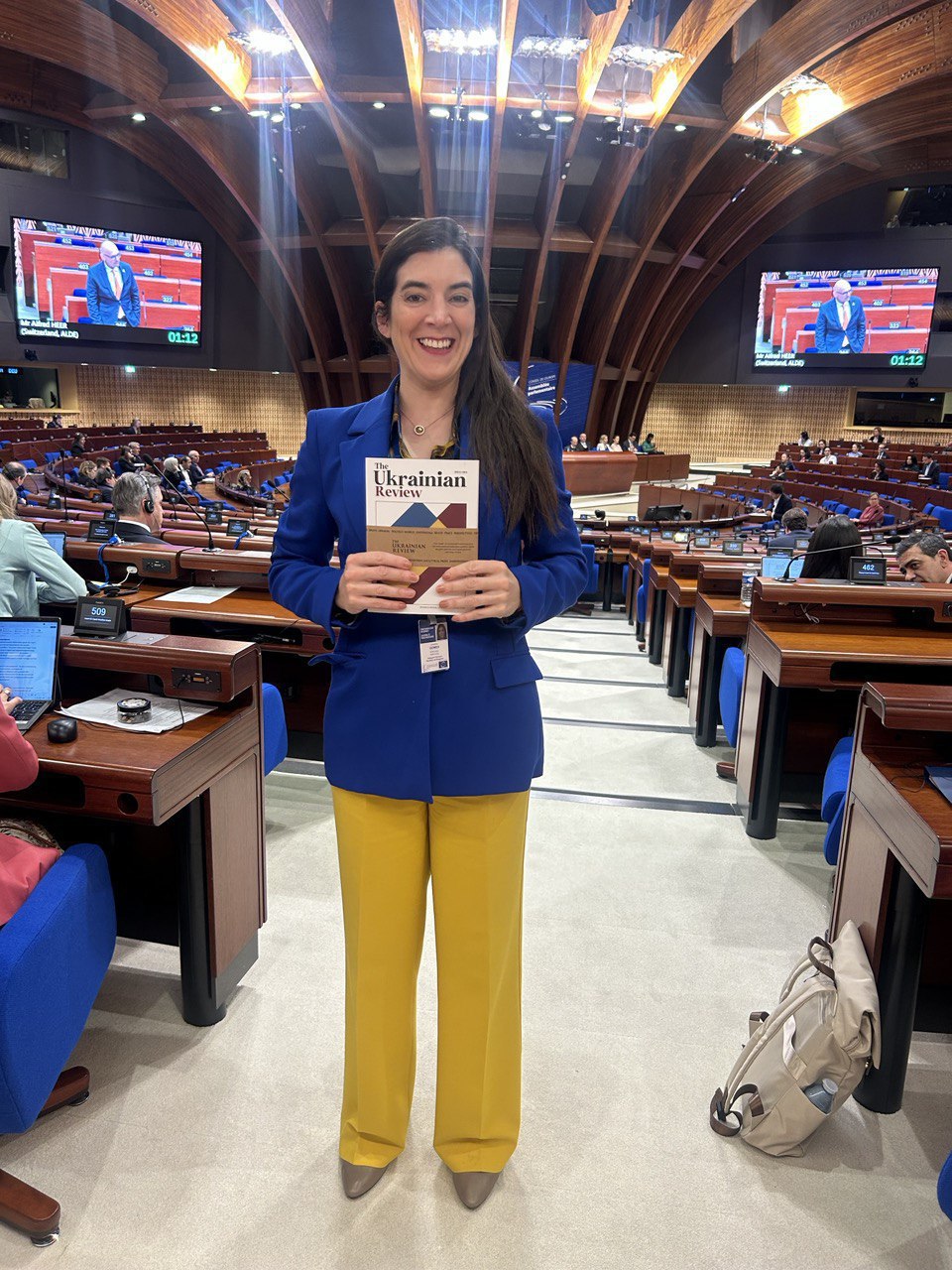 PACE delegate holding The Ukrainian Review during the session in Strasbourg, April 2025.