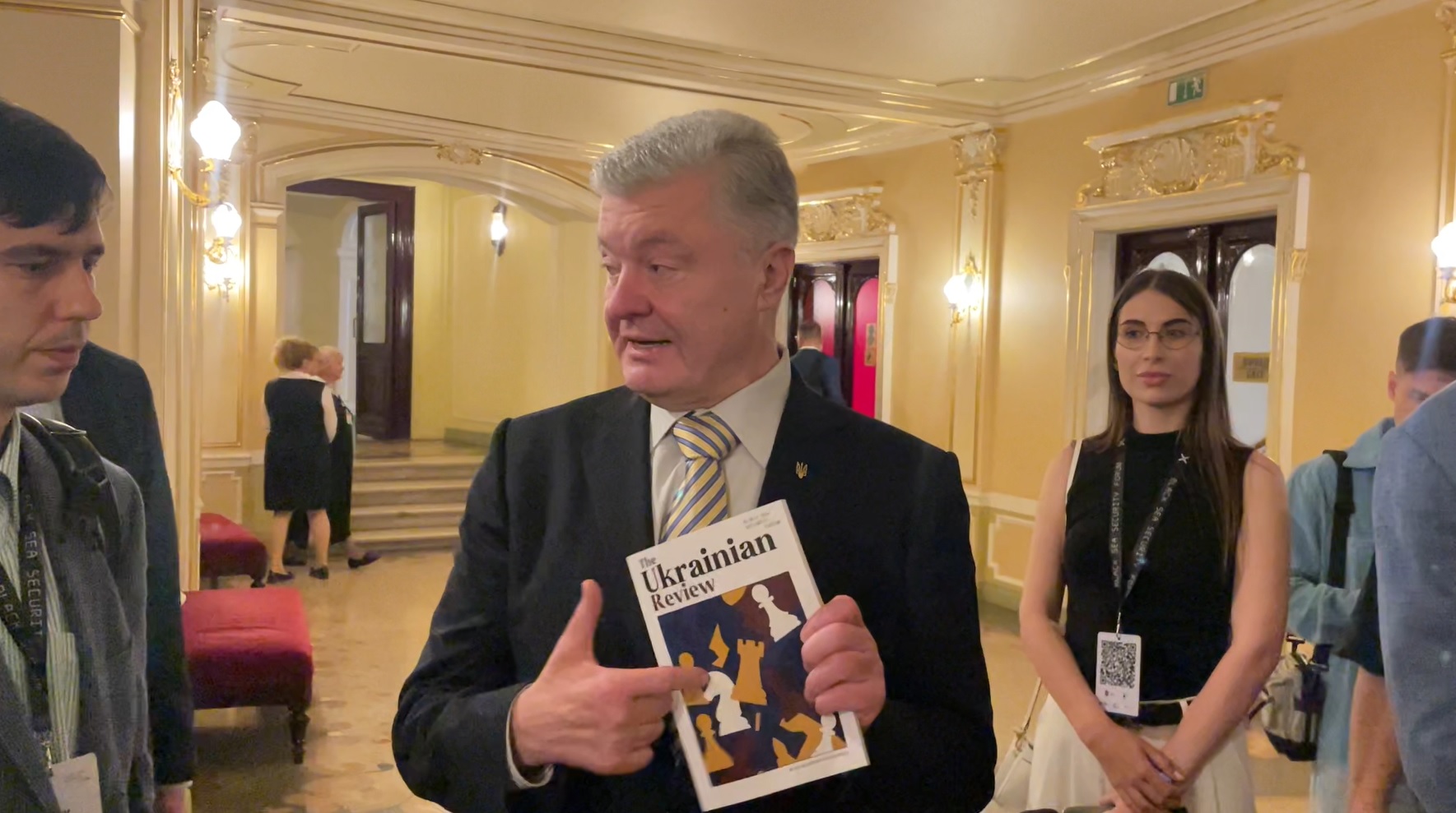 Petro Poroshenko at the Black Sea Security Forum 2025 holding The Ukrainian Review magazine