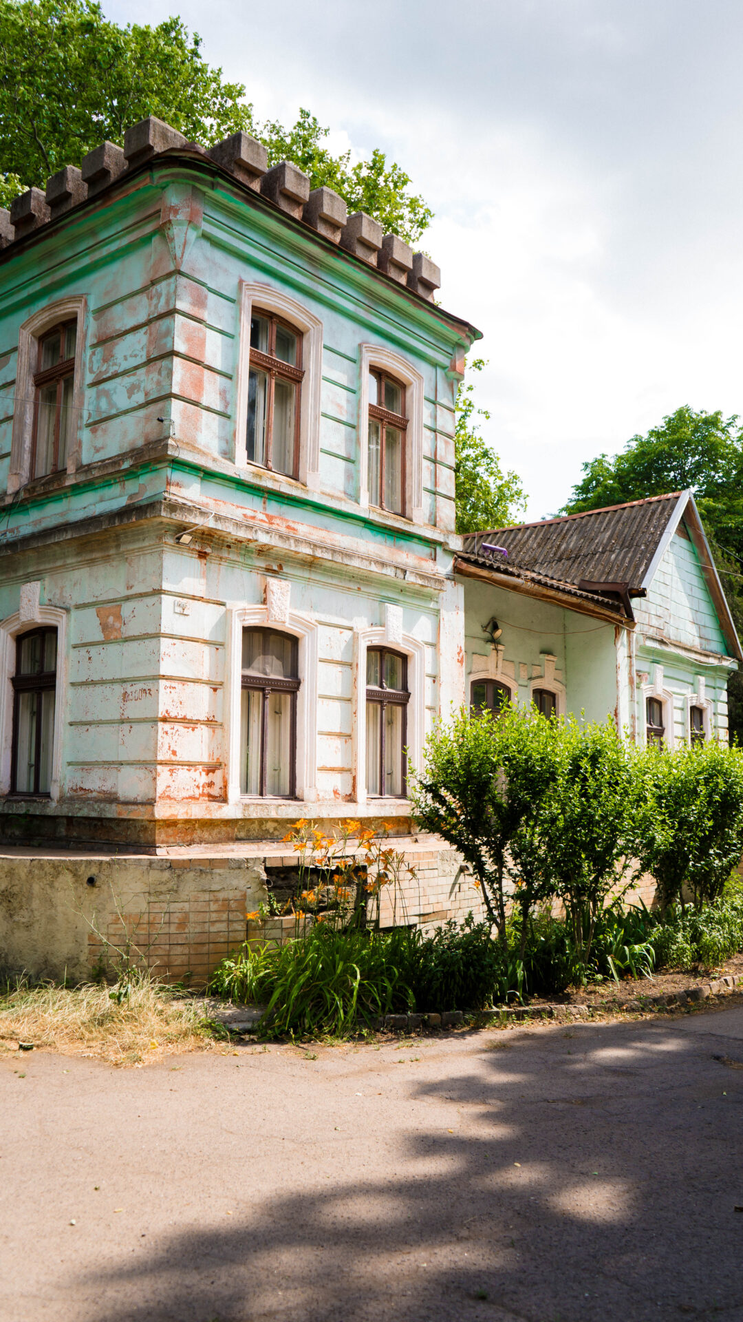 Facade of a historic building at Zelenaya Gorka rehabilitation site in Odesa, surrounded by greenery — future recovery center for veterans, children and families