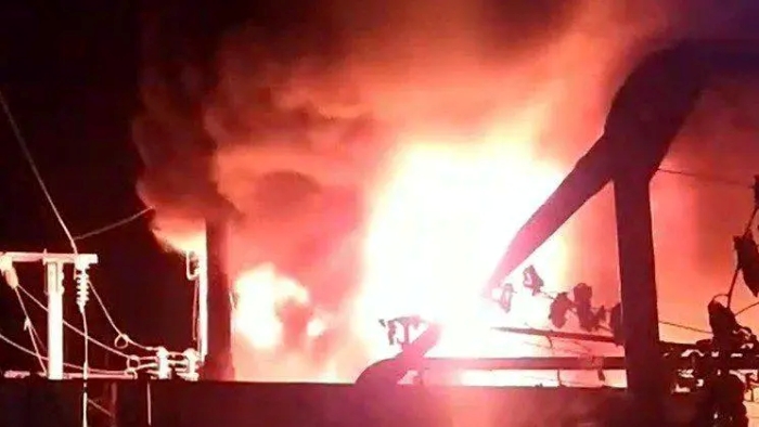 The image shows damaged railroad infrastructure on fire following the Russian attack on September 17, 2025