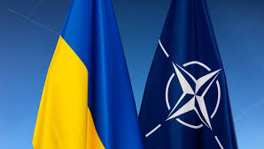 Ukrainian and NATO flags depicted together, symbolizing military cooperation and alliance support