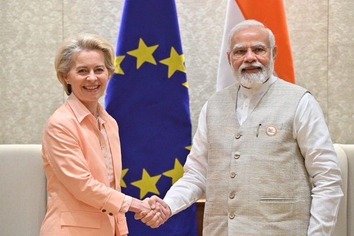 An image showing European Commission President Ursula von der Leyen and Indian Prime Minister Narendra Modi shaking hands during an official meeting, symbolizing EU–India partnership, diplomacy and high-level trade or cooperation talks.