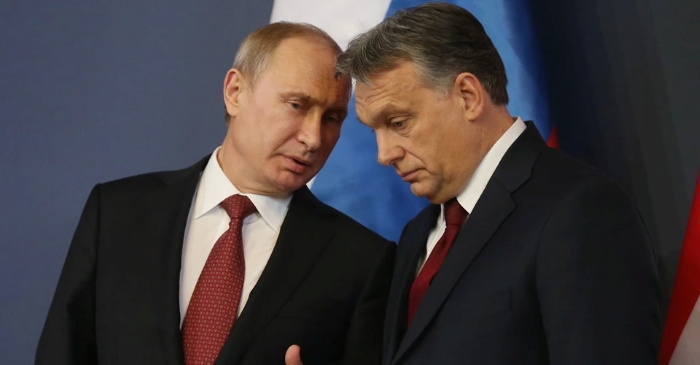 This picture captures Putin and Viktor Orban saying something private