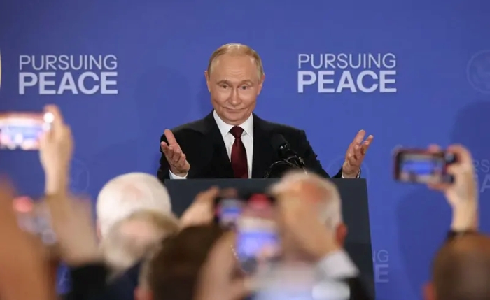 Vladimir Putin is depicted articulating something during the Alaska summit