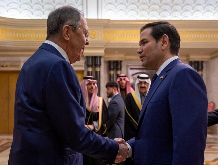 Russian Foreign Minister Sergei Lavrov and US Secretary of State Marco Rubio are depicted shaking hands