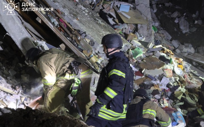 Rescuers work through the night clearing debris after a Russian drone strike on a dormitory in Zaporizhzhia, Ukraine, October 30, 2025. Emergency workers from the State Emergency Service of Ukraine search for survivors among the rubble following another massive attack on Ukraine’s energy and civilian infrastructure.