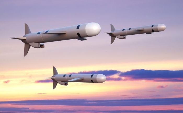 3D illustration of U.S. Tomahawk long-range cruise missiles flying against a colorful sunset sky — symbolizing advanced Western weaponry and strategic defense technology.