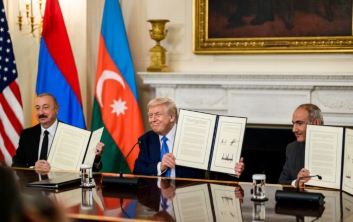 Azerbaijani President Ilham Aliyev and Armenian Prime Minister Nikol Pashinyan and the U.S. President Donald Trump posing with documents while signing a peace agreement mediated by US President Donald Trump in the White House