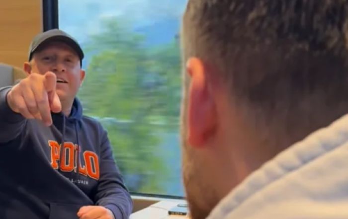 A Russian man treats Ukrainian family in train