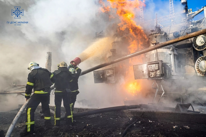 Firefighters from the State Emergency Service of Ukraine battle a massive blaze at an industrial facility in Kyiv following a russian missile strike.
