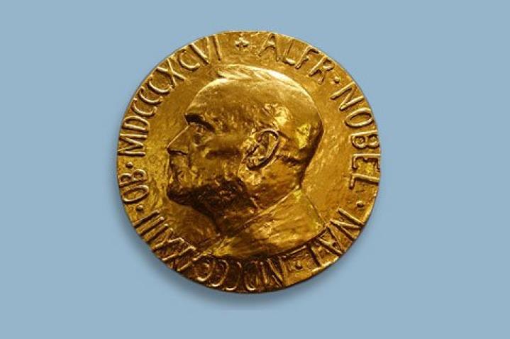 Close-up image of the Nobel Peace Prize medal featuring Alfred Nobel’s profile engraved in gold. The iconic Nobel medal represents one of the world’s most prestigious international awards, given annually for outstanding contributions to peace and humanitarian efforts.
