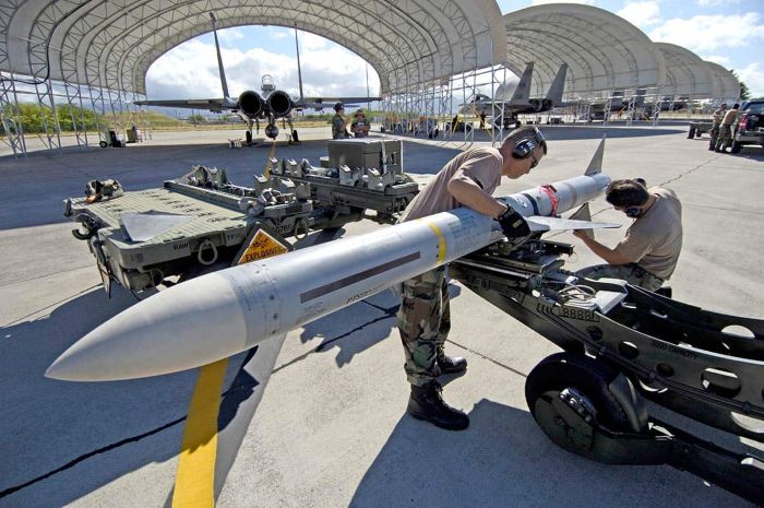 AIM-7 Sparrow air-to-air missile is depicted being transported by militaries