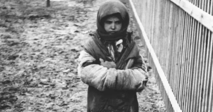 The picture shows exhausted Ukrainian girl during the Holodomor 1932 - 1933