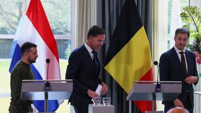 The picture portrays Ukrainian President Volodymyr Zelenskyy, Dutch Prime Minister Mark Rutte, and Belgian Prime Minister Alexander De Croo walk after a joint press conference in The Hague on May 4, 2023