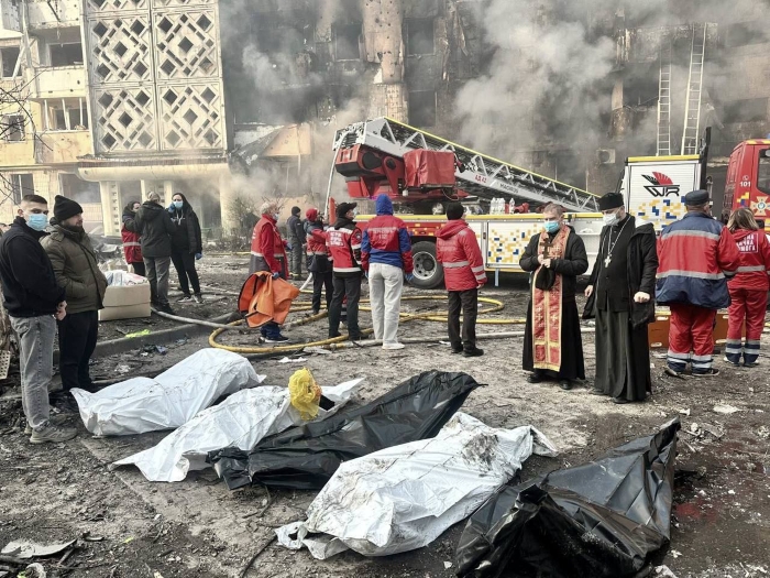 Dead bodies are lying on the ground, surrounded by priests after the Russian attack on Ternopil