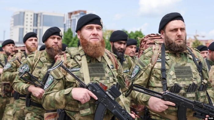 The picture shows Chechens “Kadyrovites” servicemen in the uniform
