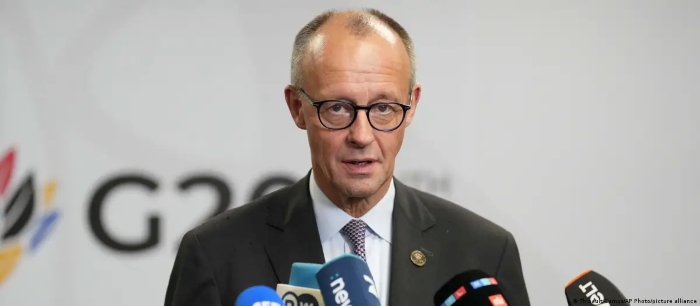 The picture portrays German Chancellor Friedrich Merz