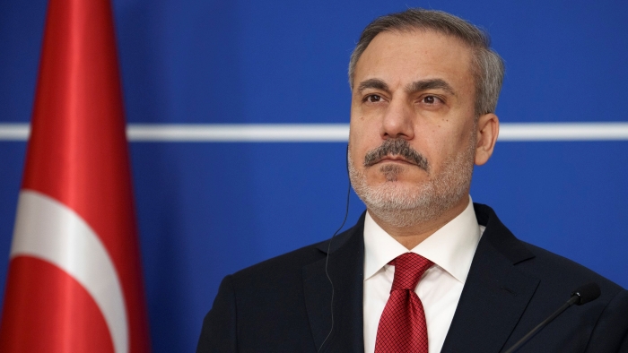The picture portrays Turkish Foreign Minister Hakan Fidan during a press conference in Bucharest, Romania,