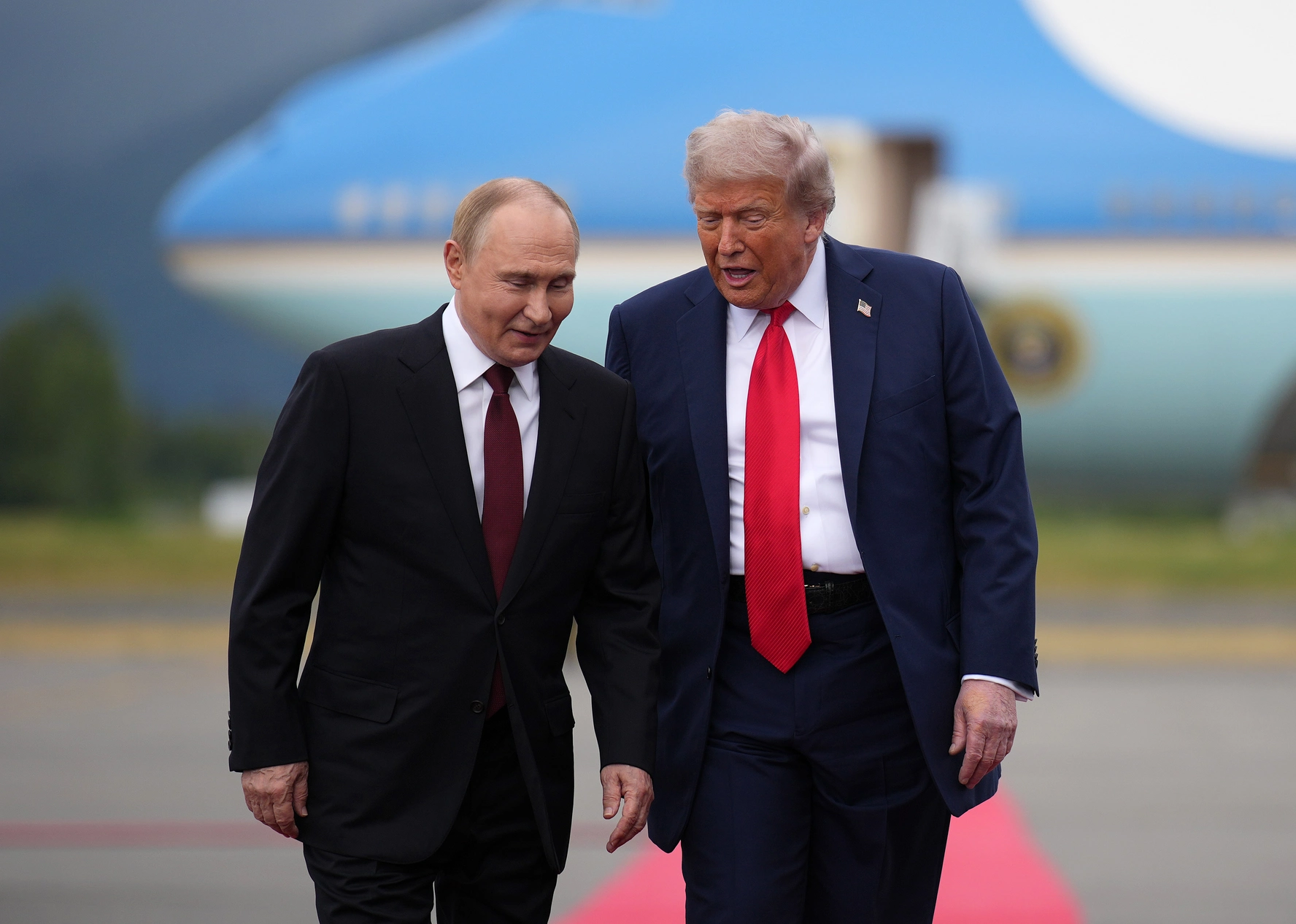 U.S. President Donald Trump walks with Russian President Vladimir Putin as they arrive at Joint Base Elmendorf-Richardson in Anchorage, Alaska, on August 15, 2025, for peace talks aimed at ending the war in Ukraine / Andrew Harnik, Getty Images