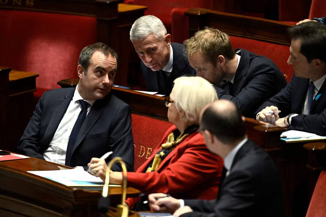 Prime Minister Sebastien Lecornu (left) during a debate on defense strategy at the National Assembly in Paris, December 10, 2025. Julien de Rosa / AFP