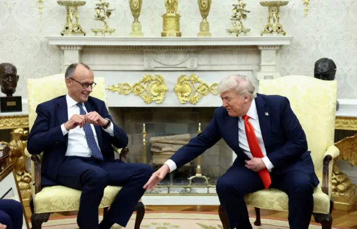The picture portrays The U.S. President Donald Trump and German Chancellor Freidrich Merz in Oval Office