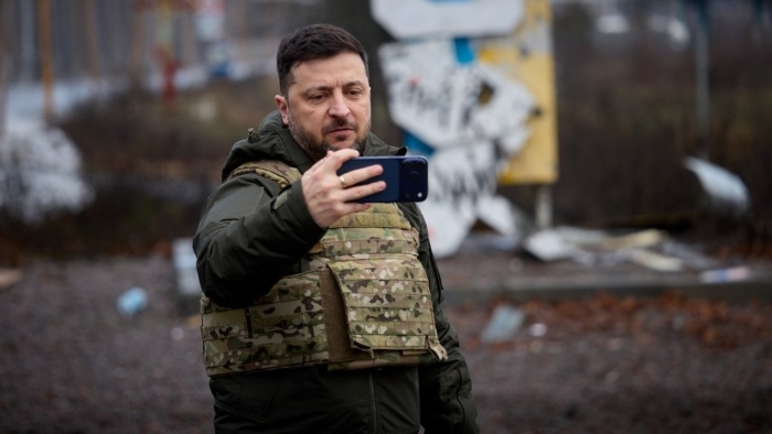 The picture portrays President of Ukraine Volodymyr Zelenskyy records an address during his visit to Kupiansk in the Kharkiv region on December 12, 2025