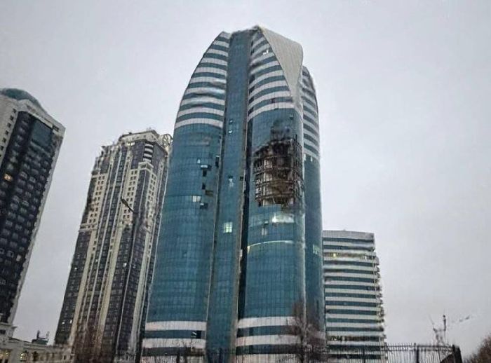 The picture shows Grozny City building partially destroyed by the drones