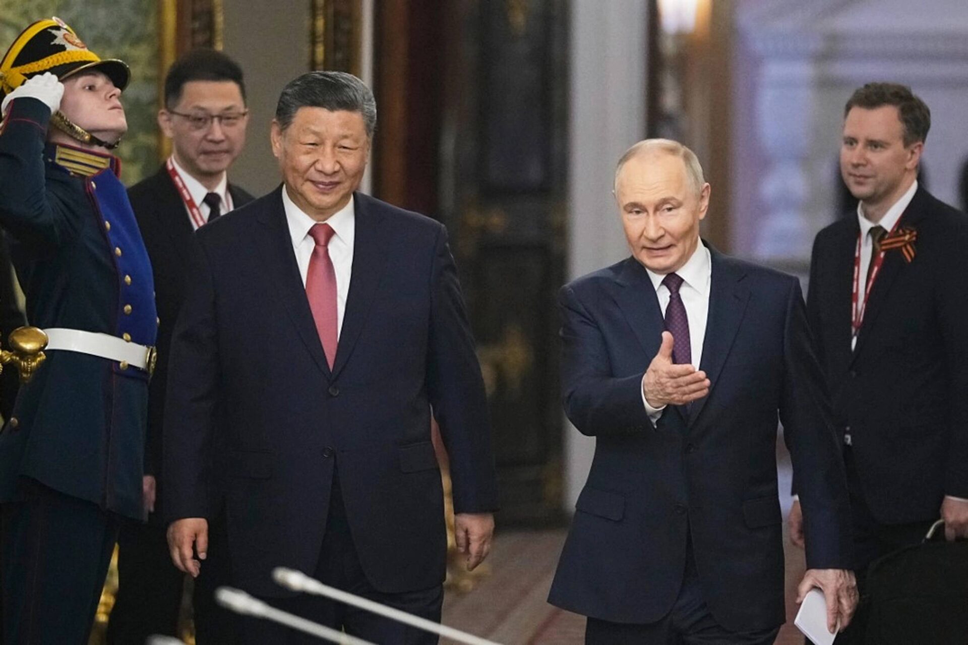 Russian President Vladimir Putin and Chinese President Xi Jinping arrive for talks at the Kremlin in Moscow on May 8, 2025