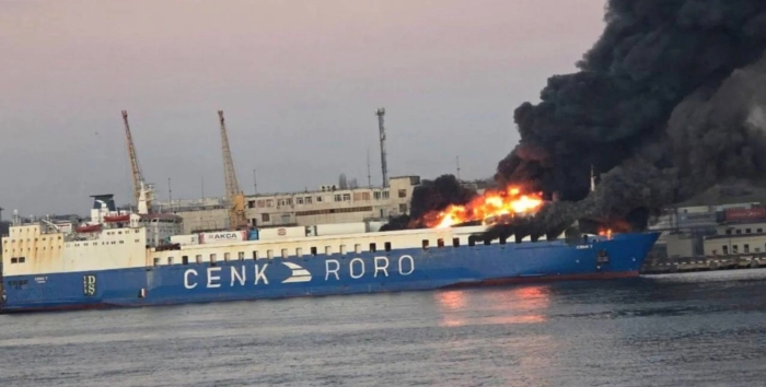 The picture shows burning ship of Turkish company