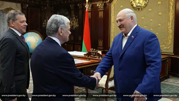 The picture shows how Belarusian leader Alexander Lukashenko greets John Cole, representative of US President Donald Trump, during a meeting in Minsk