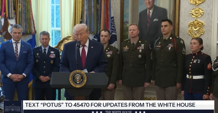 U.S. President Donald Trump delivers a statement at the White House, standing at a presidential podium and surrounded by senior military officers in uniform.