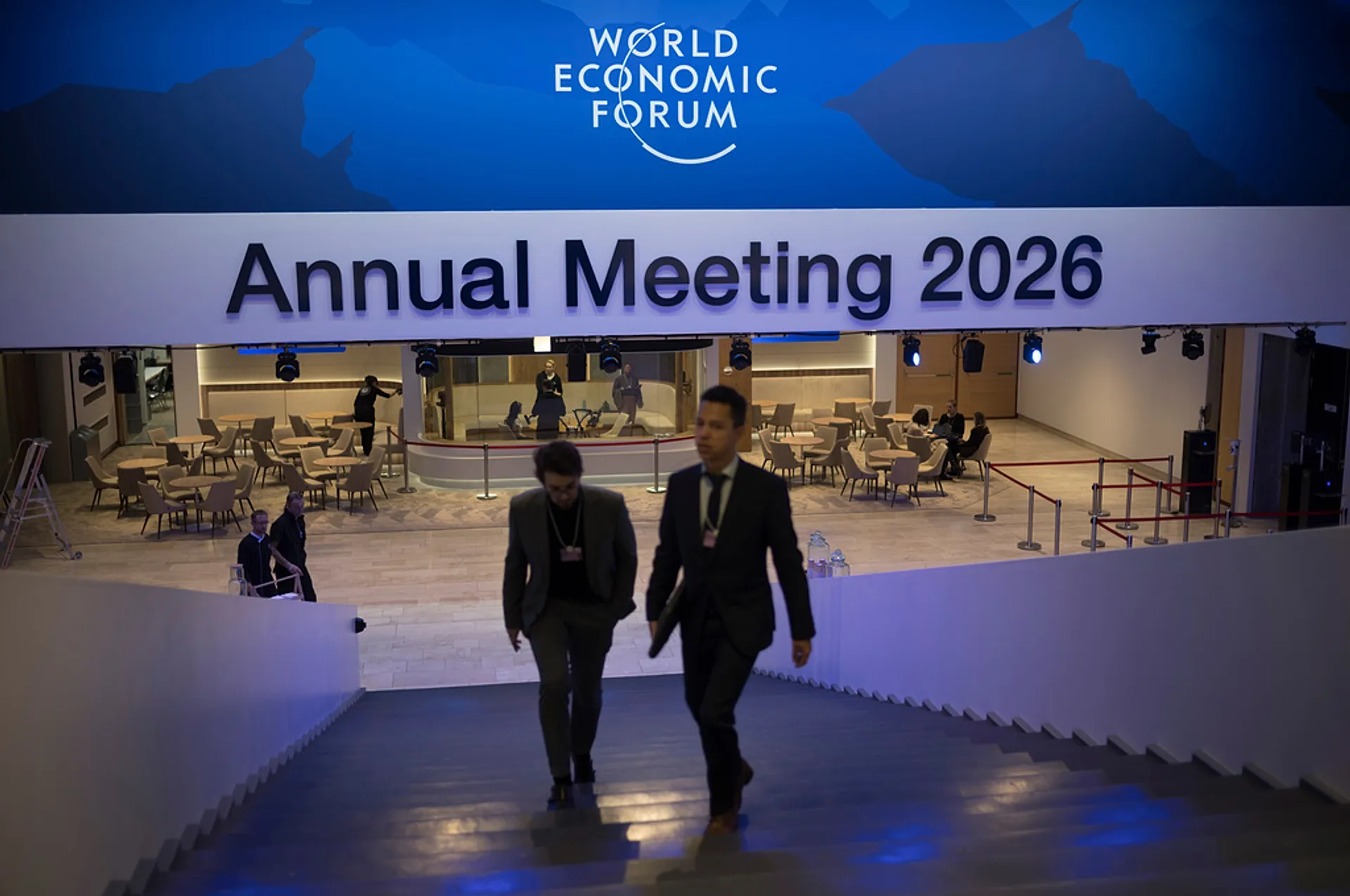 Two men walk up the stairs at the Congress Center where the Annnual Meeting of the World Economy Forum takes place in Davos, 18 January 2026 / Photo: AP