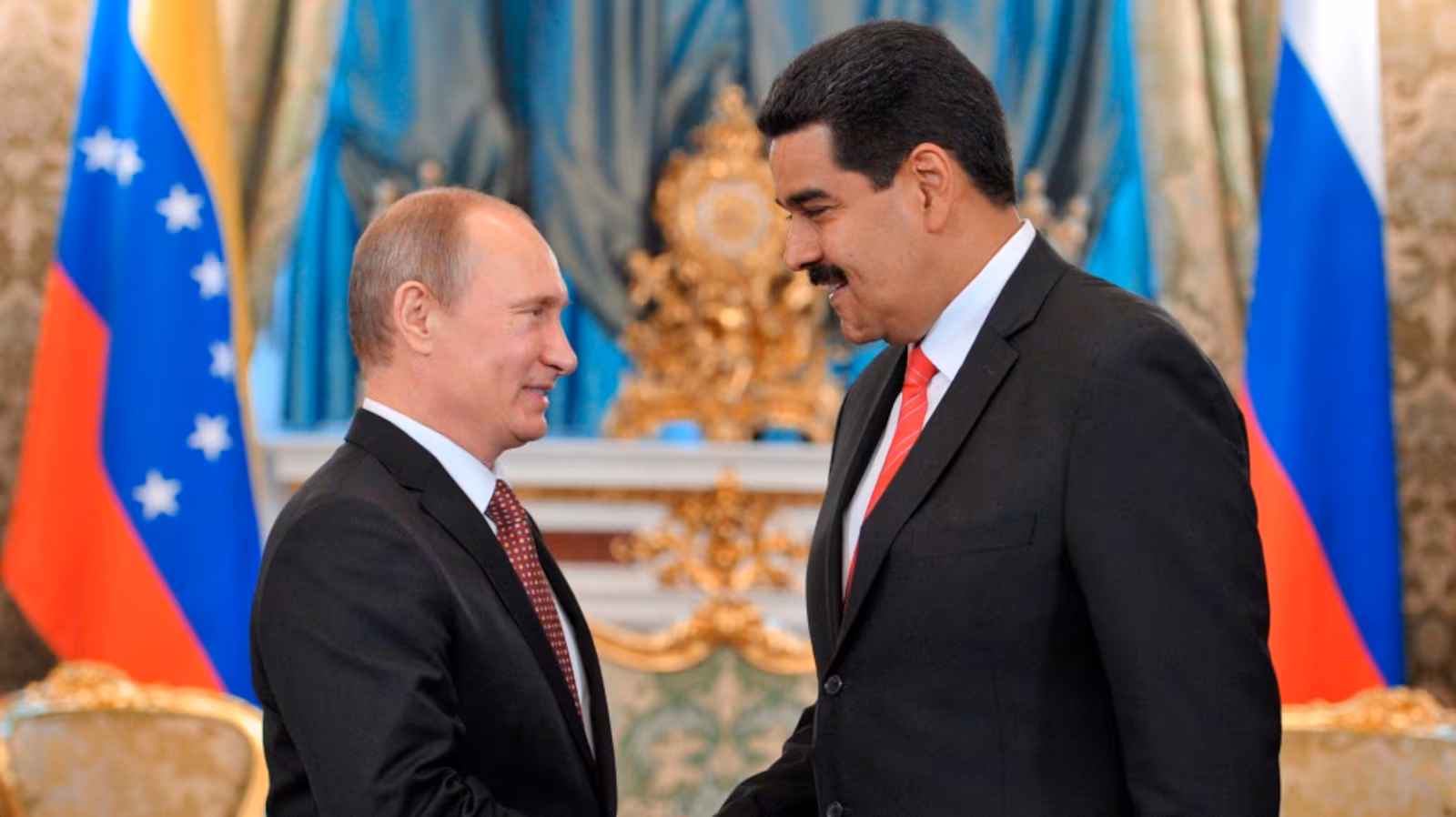Russia's President Vladimir Putin, left, shakes hands with Venezuelan President Nicolas Maduro during a meeting at the Kremlin in Moscow on Tuesday, July 2, 2013. / AP Photo