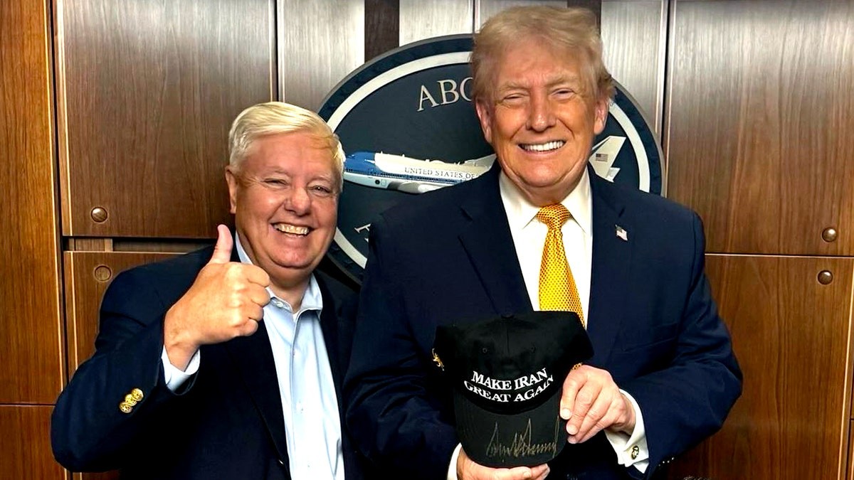 Sen. Lindsey Graham posted a photo of himself posing with President Donald Trump, who is holding a signed "Make Iran Great Again" hat