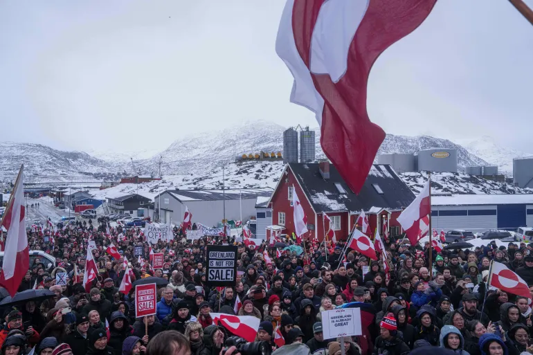 People protest against US President Donald Trump's policy towards Greenland in front of the US Consulate in Nuuk, Greenland on January 17, 2026 [Evgeniy Maloletka/AP]