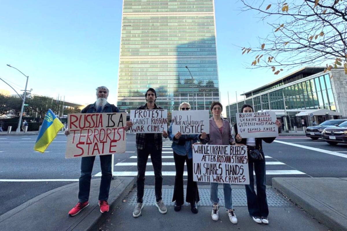 Members of the Ukrainian community gather outside the UN Headquarters against war crimes