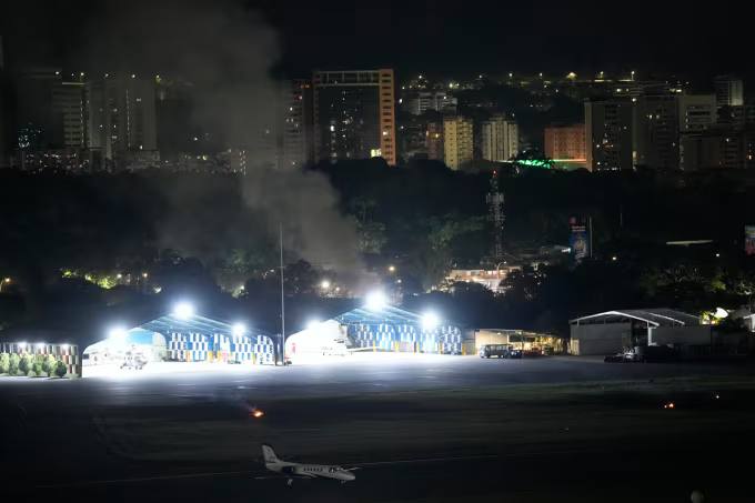Smoke raises at La Carlota airport after explosions and low-flying aircraft were heard in Caracas, Venezuela on January 3, 2026