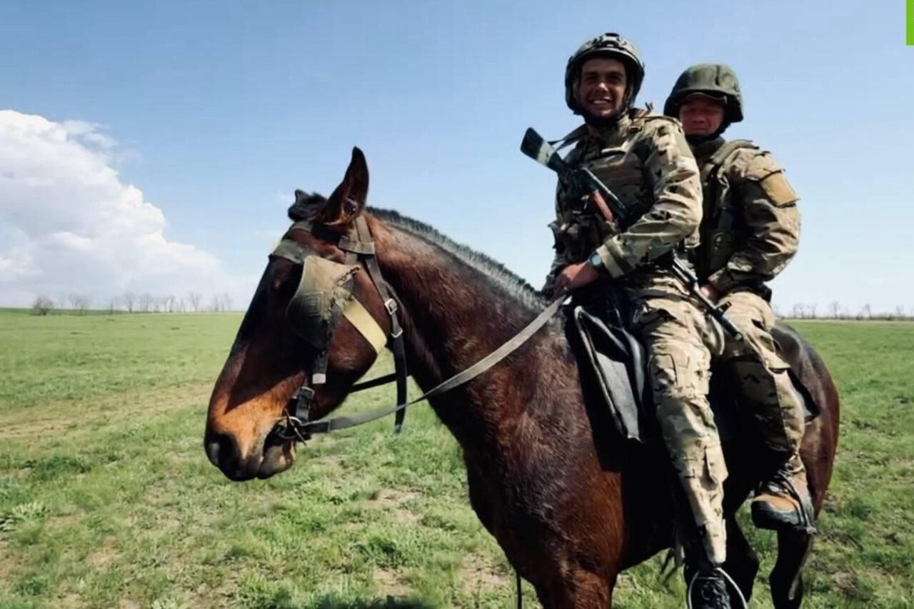 Russian soldiers riding horses during a military training exercise in the Donetsk region in 2025