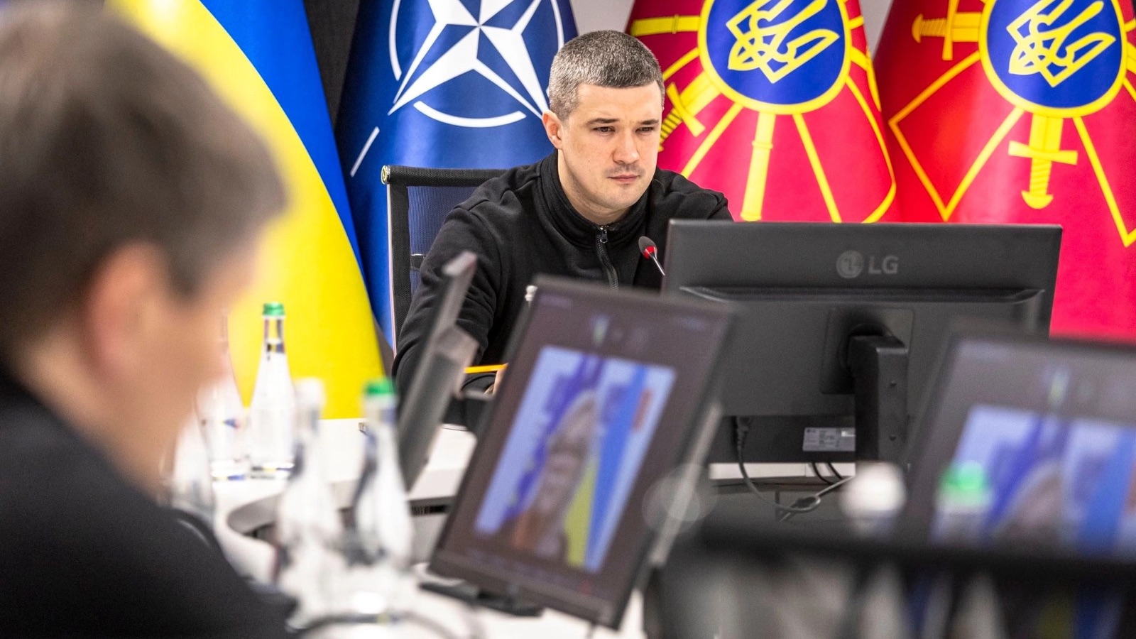 Minister Mykhailo Fedorov sits at his desk