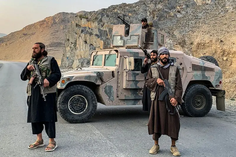 Taliban security forces monitor a border crossing between Afghanistan and Pakistan