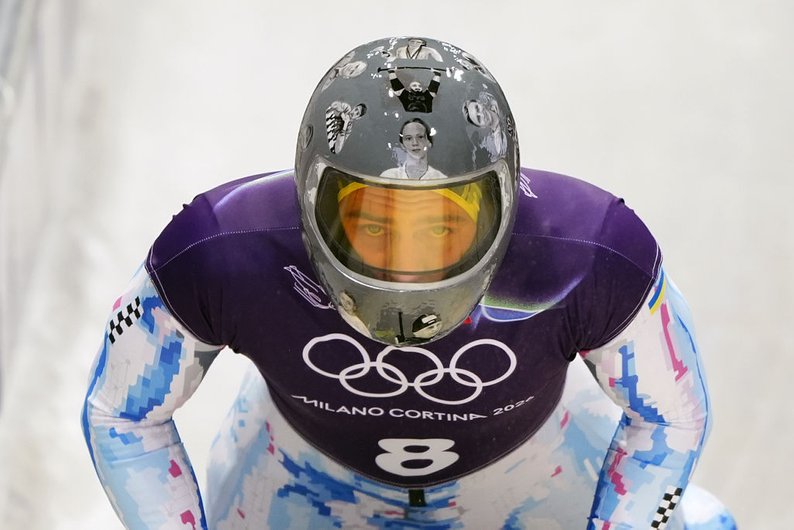 Vladyslav Heraskevych’s helmet at the 2026 Olympics featuring images of fallen Ukrainian athletes