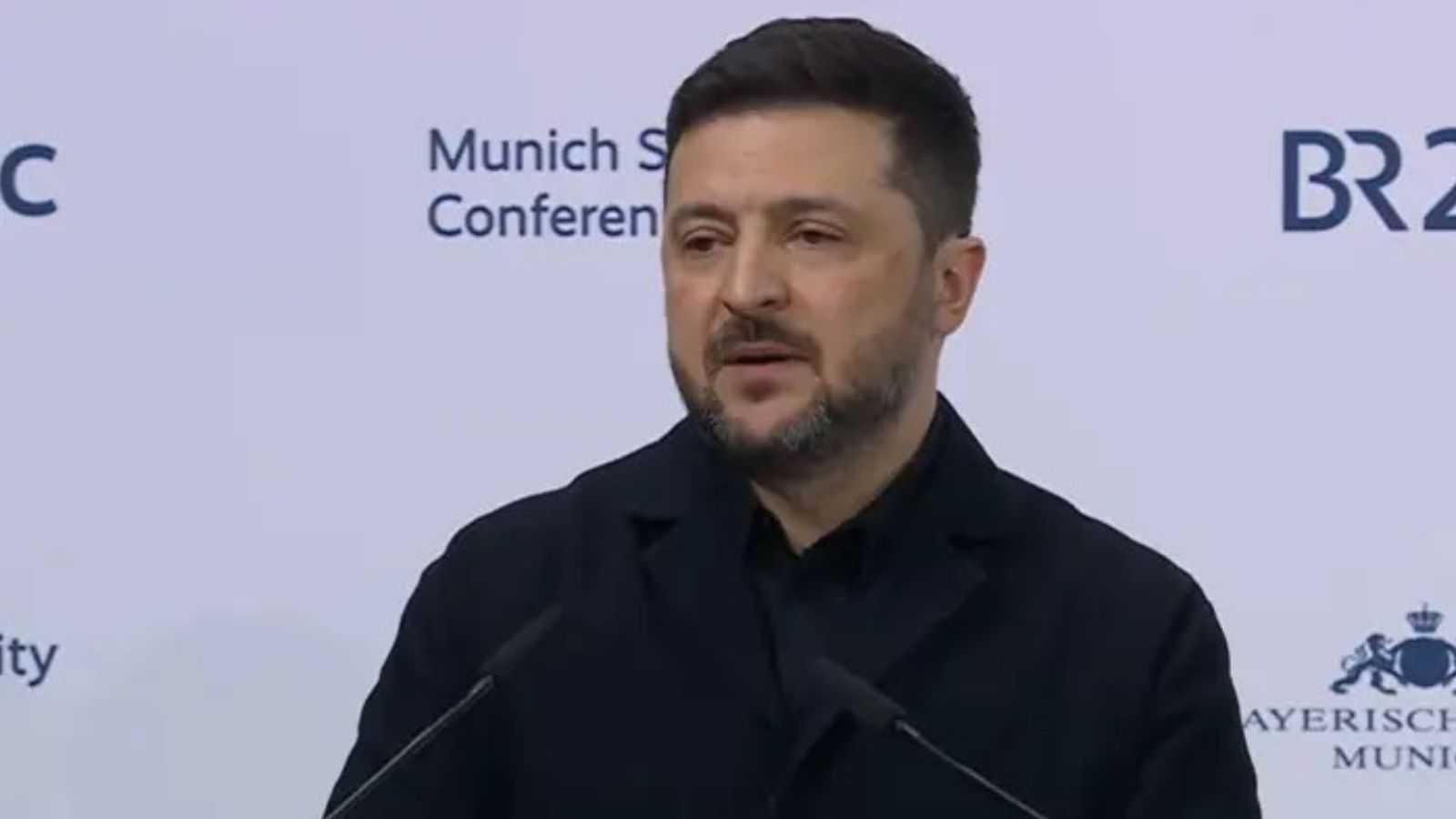 President of Ukraine Volodymyr Zelenskyy speaking at the podium during the Munich Security Conference.