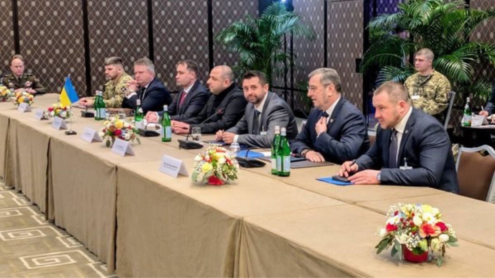 Representatives of the Ukrainian delegation, including Rustem Umerov and Davyd Arakhamia, sitting at a negotiation table in a conference hall.