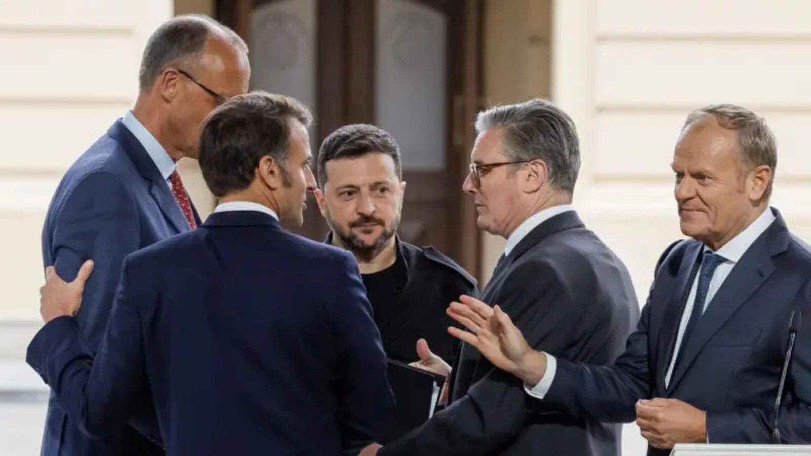 Volodymyr Zelenskyy among European leaders during an official outdoor meeting.