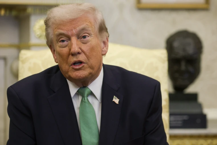US President Donald Trump sits in his office