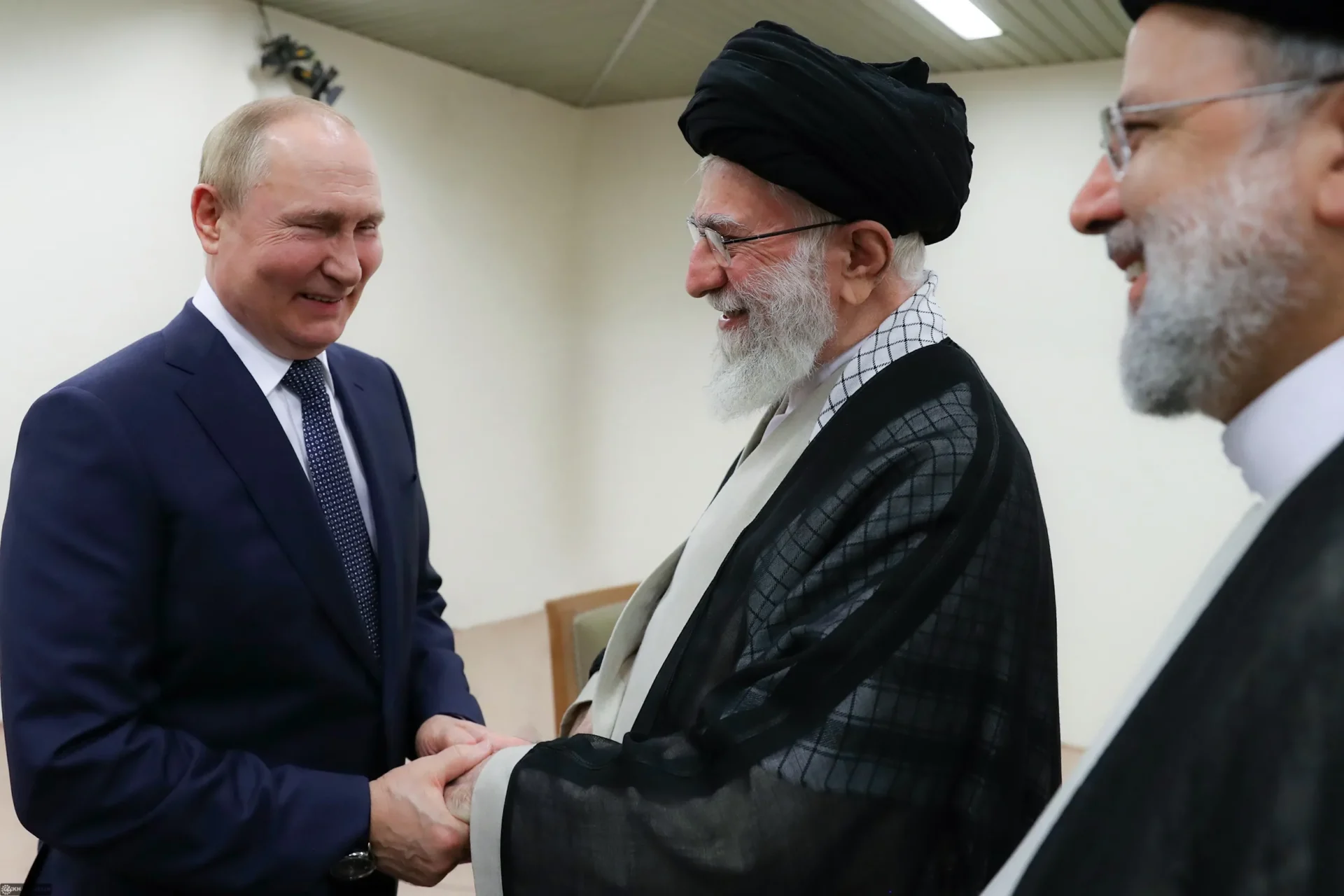 Putin and Khamenei are shaking hands