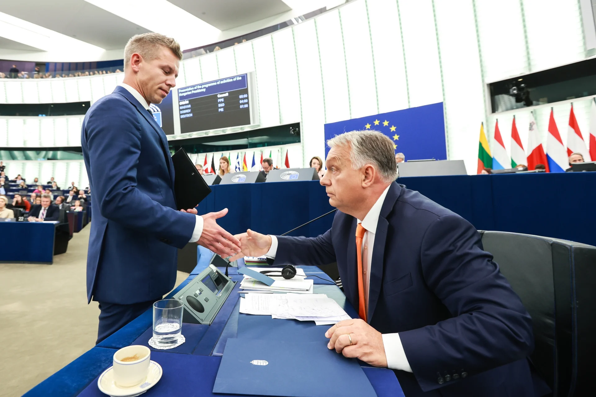 Viktor Orban and Peter Magyar shake hands