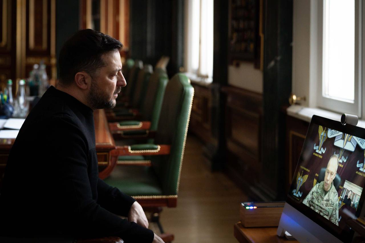 Volodymyr Zelenskyy communicates on a laptop with Oleksandr Syrskyy at an online meeting