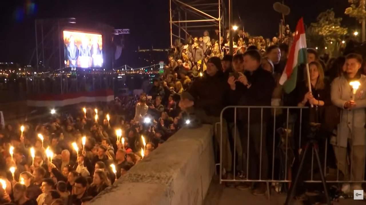Hungarians listen to Peter Magyar's victory speech