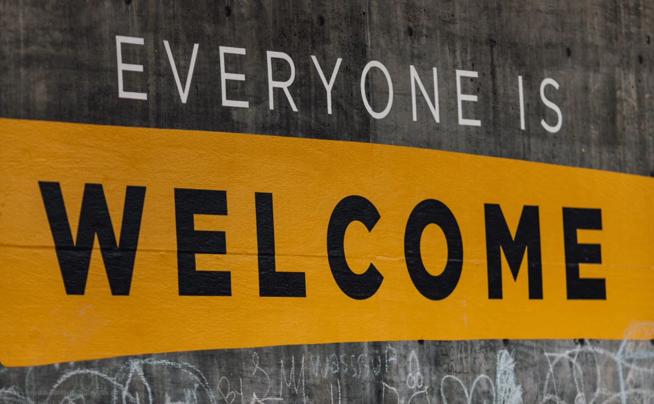 "Everyone is welcome" - writing on the wall